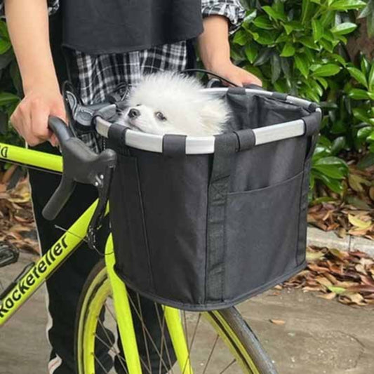 Panier de vélo pour chien noir avec petit chien blanc, détail des sangles et fixation