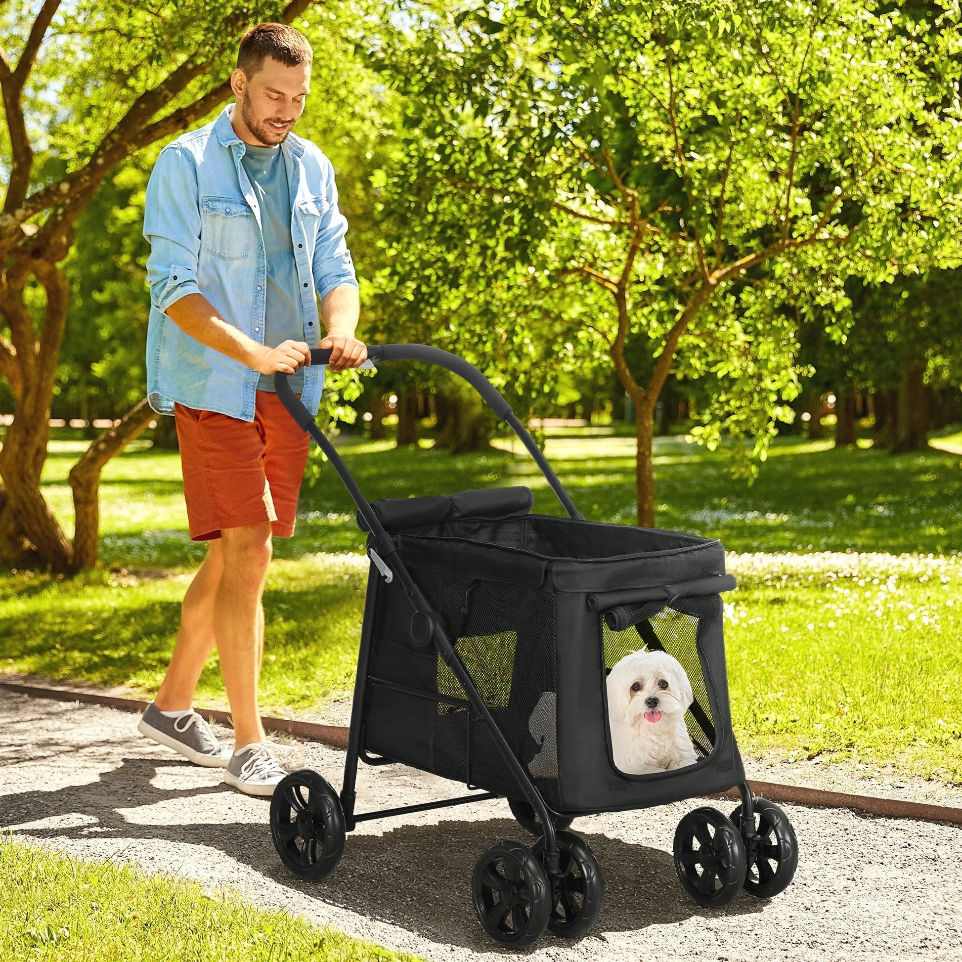 Poussette pour chien 20 kg noire avec fenêtres en maille, chien blanc dans le compartiment.