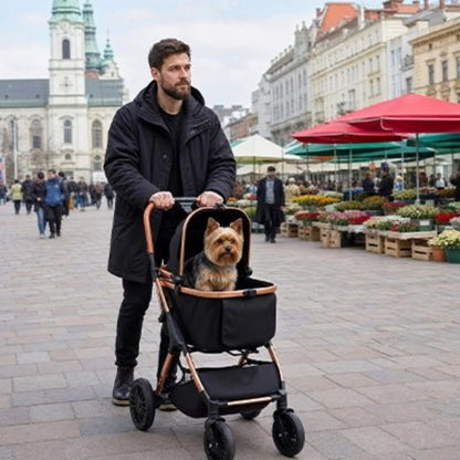 Poussette pour chien noire avec panier souple et roues pivotantes, cadre couleur cuivre.